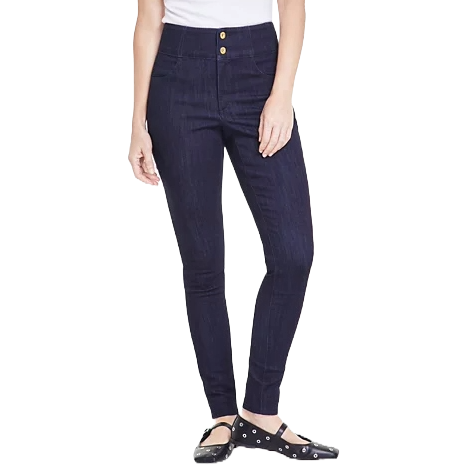 INC High-Rise Skinny Jeans are dark denim with a fitted silhouette, featuring double-button closure and ankle-length cut. They are paired with black flats adorned with small round embellishments.