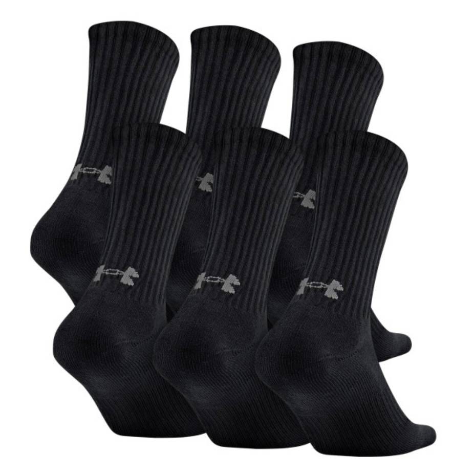 Six pairs of black Under Armour crew socks with ribbed detailing and the brand's logo on the ankle area.