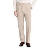 A man is wearing beige dress pants with a pleated front, paired with a white shirt and brown leather loafers.