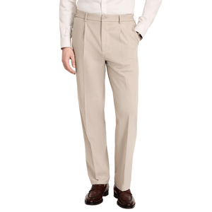 A man is wearing beige dress pants with a pleated front, paired with a white shirt and brown leather loafers.