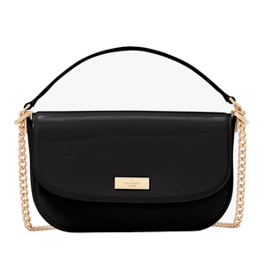 Kate Spade Krista Chain Crossbody is a sleek black purse featuring a gold chain strap and a metal logo plate on the front. It combines patent leather with a structured, compact design for elegant versatility.