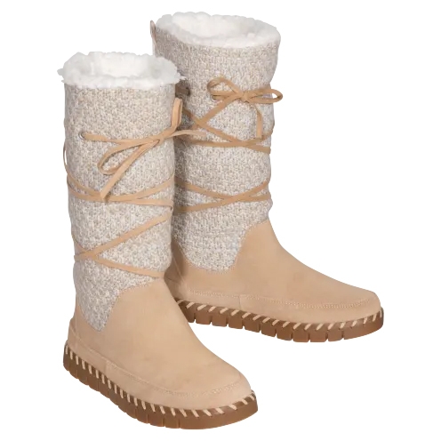 Tan-colored Muk Luks boots with a cream knit upper, laced with light brown ribbons, and lined with white faux fur, set on a ridged sole.