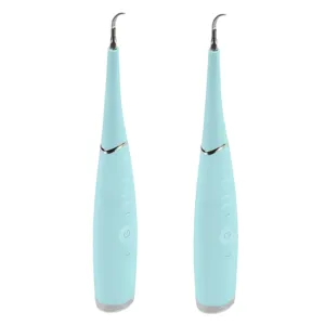 Two identical light blue electric dental cleaning devices with slender, pointed tips and power buttons on the front.