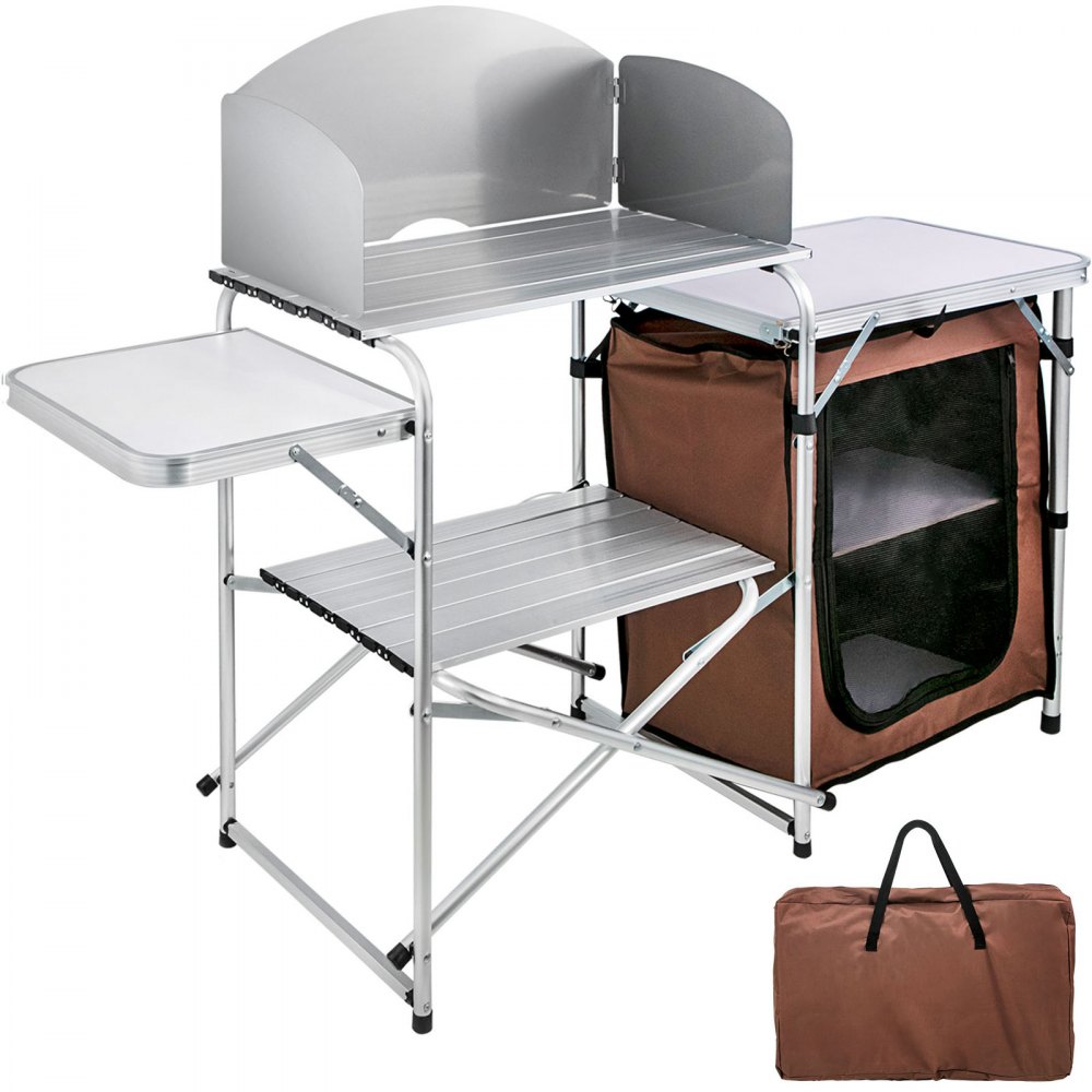 A portable camping kitchen table featuring an aluminum tabletop with a windscreen, side tables, a fabric storage organizer, and a carry bag.