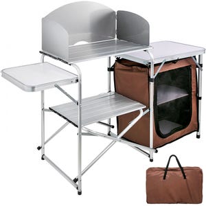 A portable camping kitchen table featuring an aluminum tabletop with a windscreen, side tables, a fabric storage organizer, and a carry bag.