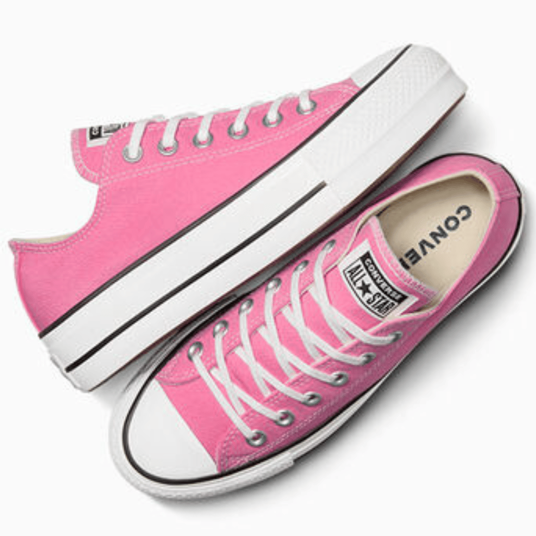Pink canvas high-top sneakers with white laces and rubber soles.