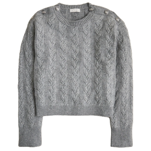 Gray cable knit sweater with button details on the shoulders, featuring ribbed cuffs and hem.