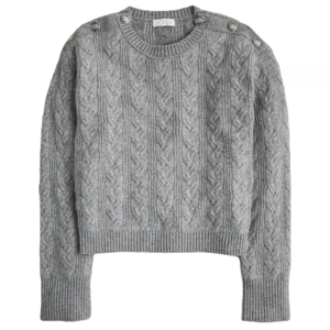 Gray cable knit sweater with button details on the shoulders, featuring ribbed cuffs and hem.