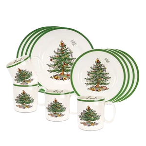 12-piece Spode Christmas Dinnerware Set includes plates and mugs featuring a festive Christmas tree design with a green border.
