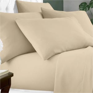 A 6-piece bamboo sheet set in beige, featuring a fitted sheet, flat sheet, and four pillowcases. The fabric appears smooth and soft, arranged on a bed with a side table visible.