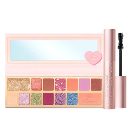 Too Faced eye shadow palette features 12 colorful shades, both matte and glittery, with a butterfly-themed design. It comes with a tube of mascara featuring a curved brush for volumizing lashes.