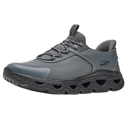 Gray athletic sneaker with a distinctive springy, perforated sole design, lace-up closure, and subtle branding on the side. Ideal for casual wear or light activities.