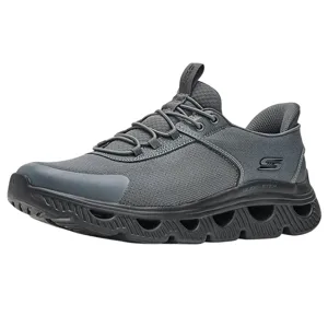 Gray athletic sneaker with a distinctive springy, perforated sole design, lace-up closure, and subtle branding on the side. Ideal for casual wear or light activities.