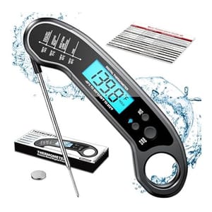 Instant Read Meat Thermometer with a digital display showing 139.8°C, featuring a foldable probe and waterproof design. Includes a user manual, spare battery, temperature guide, and gift box packaging.