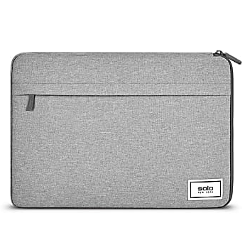 A gray laptop sleeve with a zippered pocket and a logo patch reading \“solo New York\“.