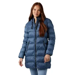 A woman is wearing a blue puffer jacket with a high collar and zippered pockets. The jacket extends to thigh-length and is paired with light blue jeans.