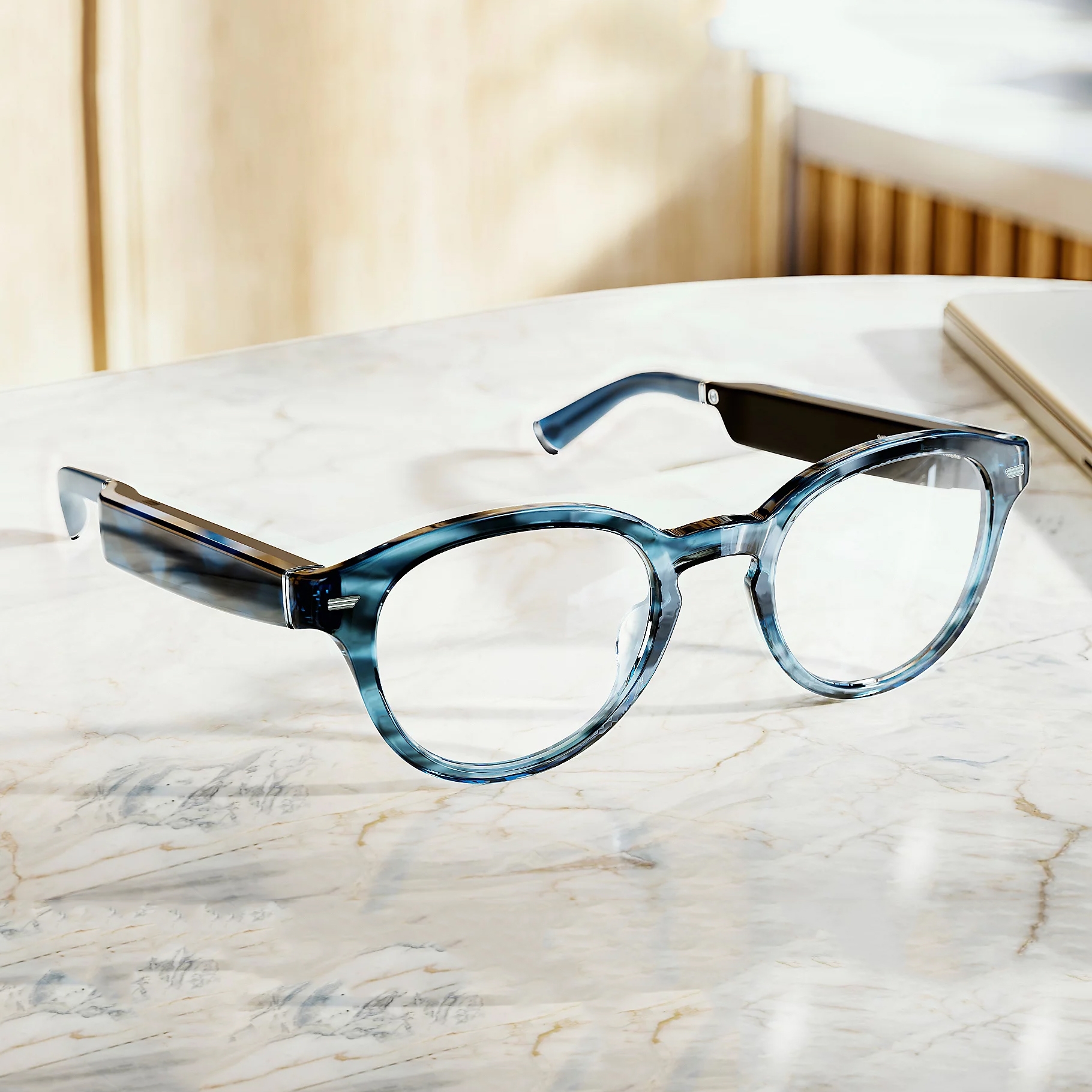 The Amazon Echo Frames are smart glasses featuring a sleek, lightweight design with built-in microphones for hands-free Alexa access. They have rectangular lenses and come in a stylish blue tortoiseshell pattern.