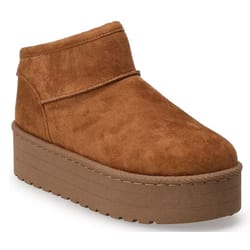 A brown suede platform ankle boot with a thick, layered sole and simple stitching details.