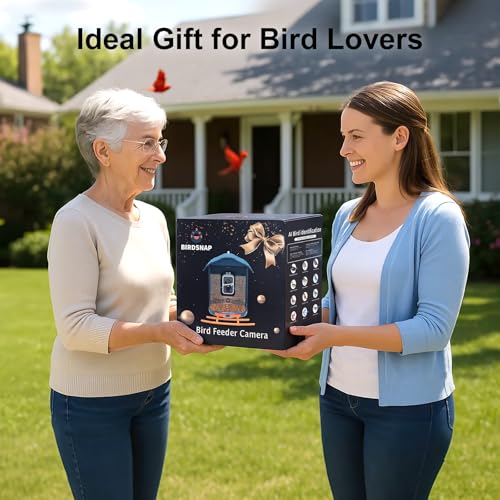 Two people exchange a \“BirdSnap\“ bird feeder camera in a garden setting, with text stating it as an \“Ideal Gift for Bird Lovers.\“