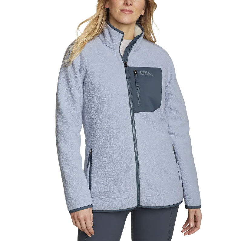 Light blue fleece jacket with a full zip, dark gray zippered chest pocket, and side pockets, worn by a model.