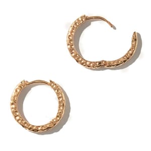 Gold hoop earrings with a textured design and latch back closure.