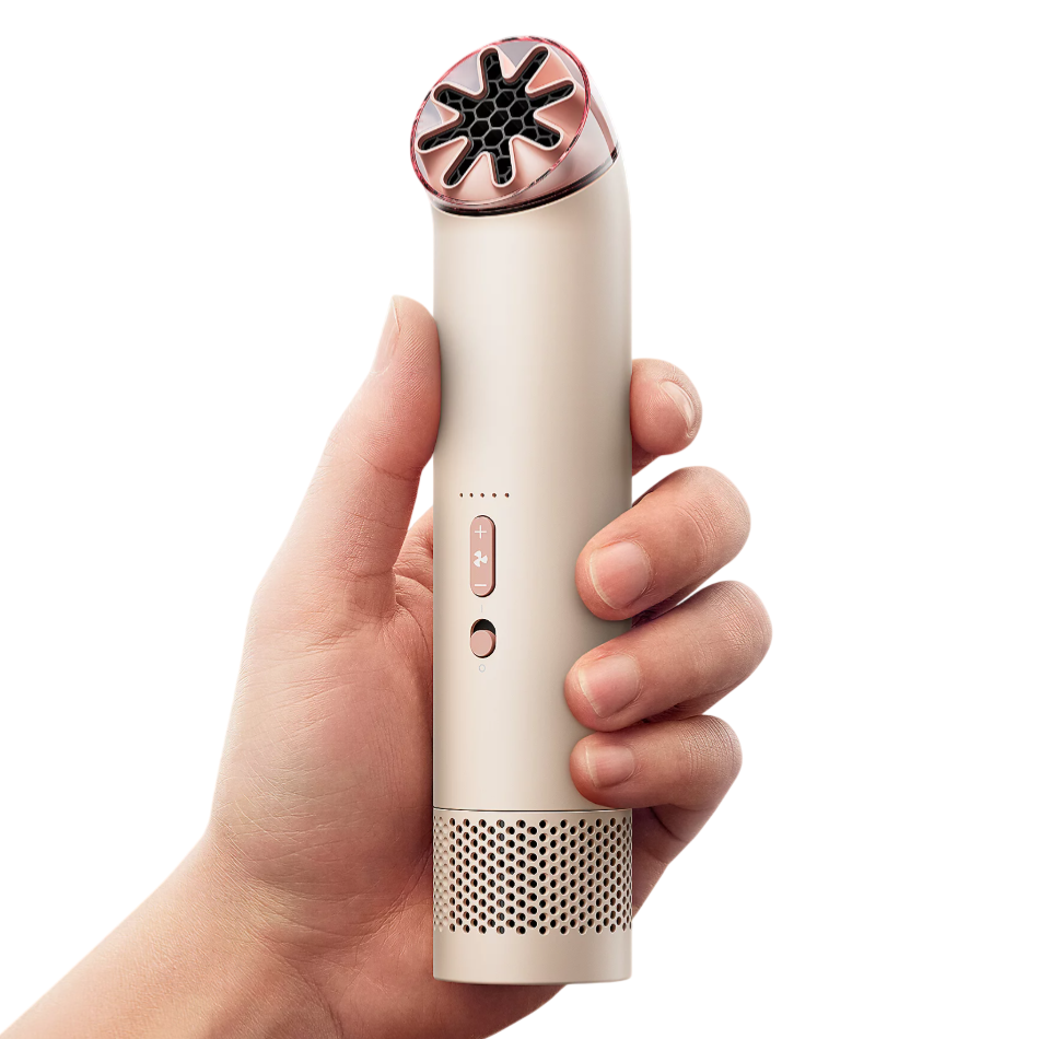 A handheld device with a sleek design, featuring a curved top with vent-like openings, control buttons, and a perforated base.