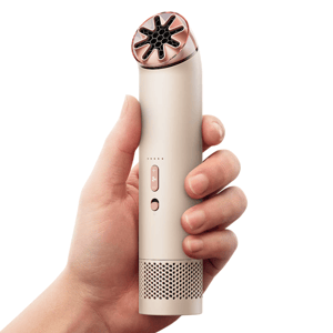 A handheld device with a sleek design, featuring a curved top with vent-like openings, control buttons, and a perforated base.