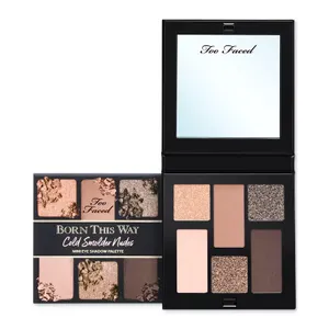 Too Faced Born This Way Cold Smolder Nudes Mini Eye Shadow Palette features six neutral and shimmering shades in a small compact with a mirror.