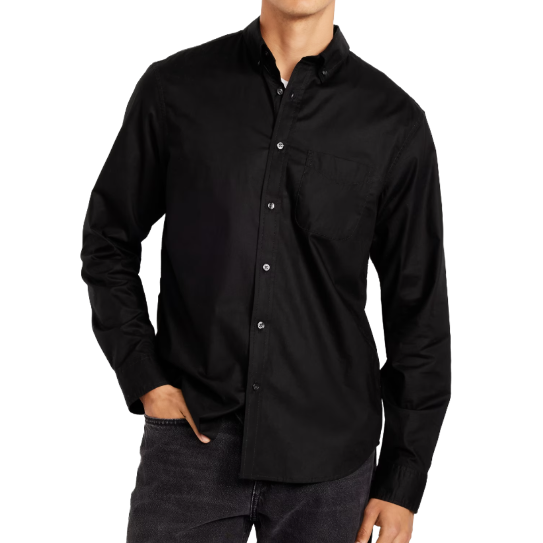 A person is wearing a black button-up shirt with a chest pocket and dark jeans.
