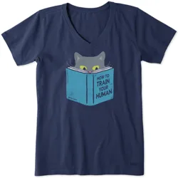 Navy blue V-neck t-shirt featuring a graphic of a cat peeking over a book titled \“How to Train Your Human.\“