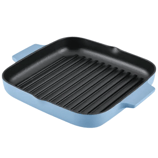 Square blue cast iron grill pan with black ridged interior and two side handles.