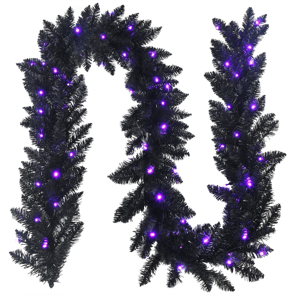 A black artificial garland with purple LED lights for decoration or holiday display.