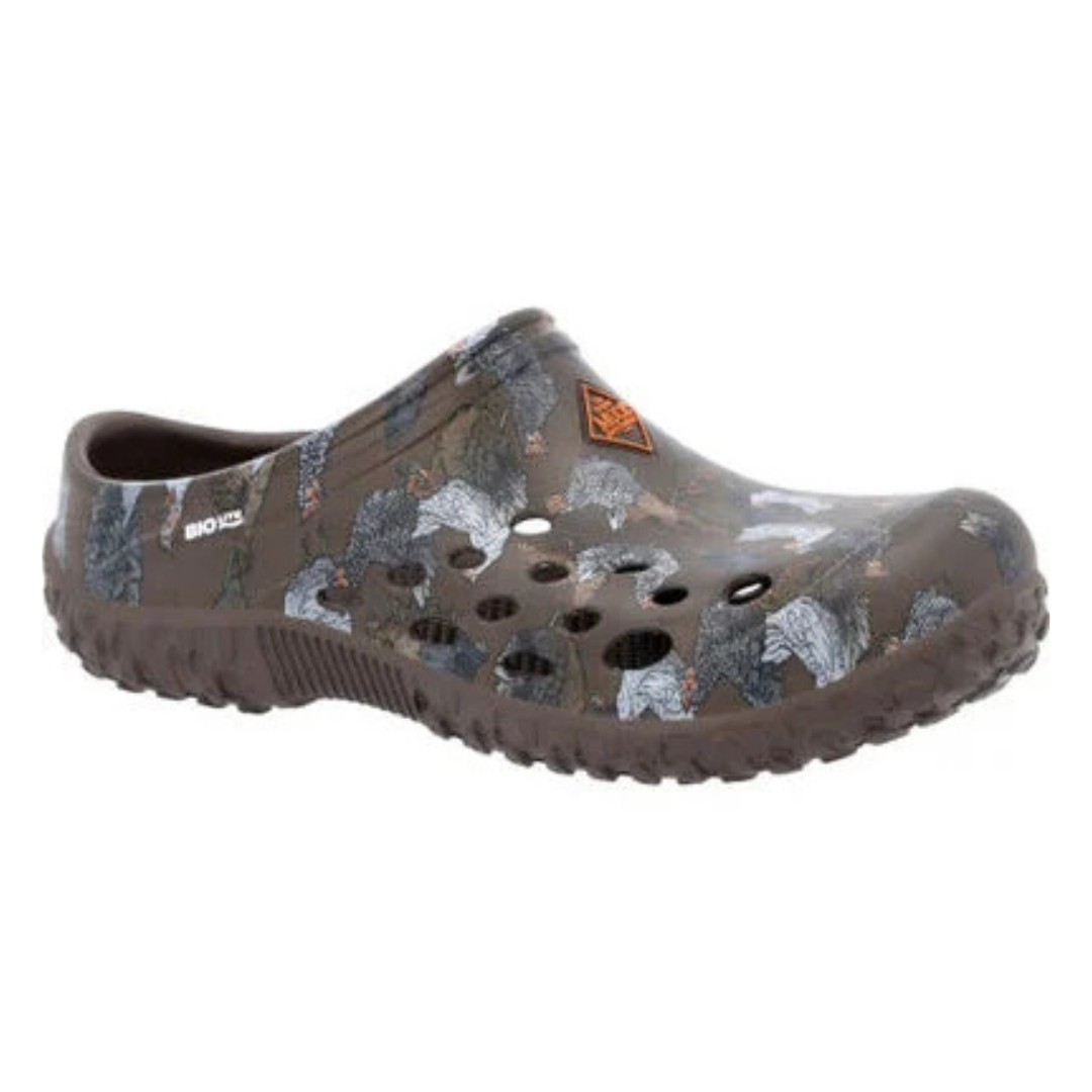 A brown slip-on clog featuring a woodland camouflage pattern with images of turkeys and multiple ventilation holes.