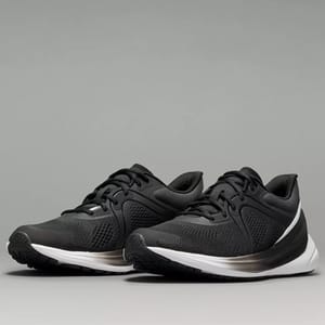 A pair of black running shoes with white soles.
