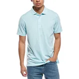 A man wearing a light blue polo shirt paired with blue jeans.