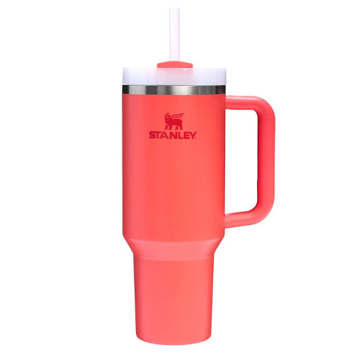 A pink Stanley stainless steel tumbler with a handle, featuring a straw and a lid.