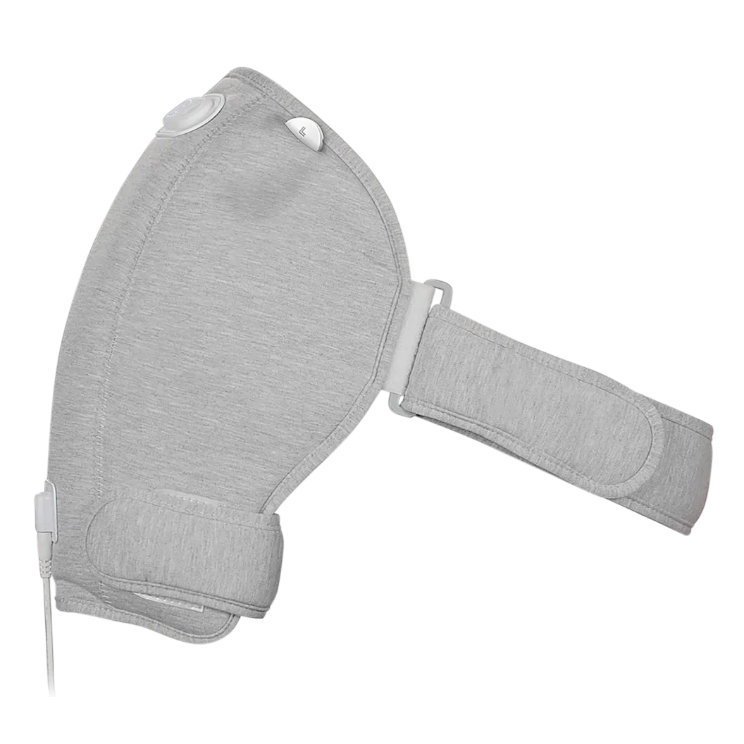 A gray shoulder massager with adjustable straps, featuring a wired connection and control buttons for settings adjustment.