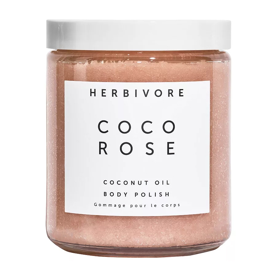 Herbivore Botanicals Coco Rose Coconut Oil Body Polish is a pink body scrub designed to exfoliate and moisturize the skin. It features coconut oil for hydration and has a rose scent.