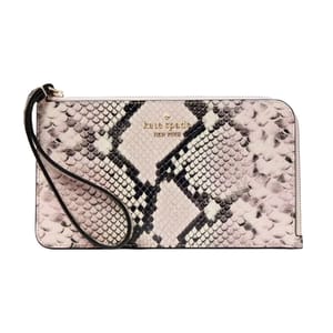 Kate Spade New York Snake Wristlet features a snakeskin pattern with a detachable strap and gold logo lettering.