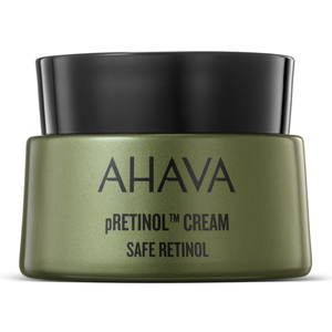 AHAVA pRetinol Cream, labeled as \“Safe Retinol,\“ is packaged in a green container with a black lid.