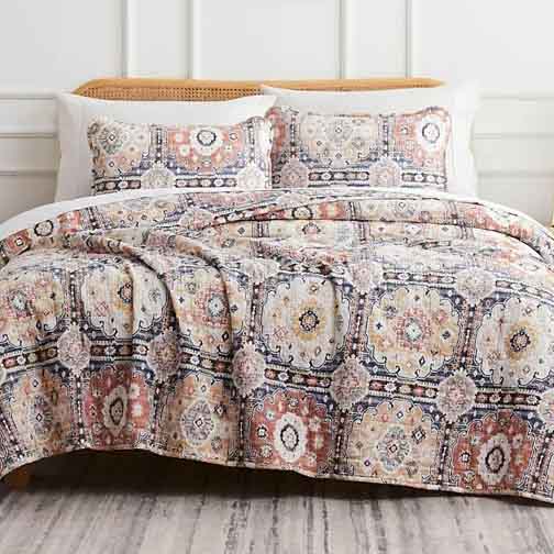 Southshore Fine Linens Quilt Sets feature an intricate, colorful geometric pattern with a mix of warm and cool tones, accompanied by matching pillow shams.