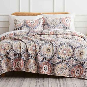 Southshore Fine Linens Quilt Sets feature an intricate, colorful geometric pattern with a mix of warm and cool tones, accompanied by matching pillow shams.