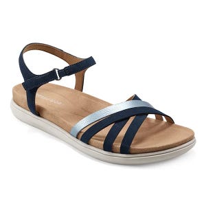 Navy blue and silver open-toe sandal with a flat white sole, featuring adjustable ankle straps and a cushioned insole for comfort.