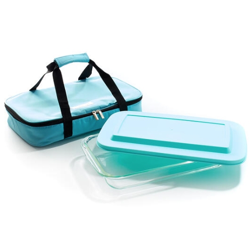 A turquoise insulated carrier with black handles contains a clear glass baking dish and a matching turquoise plastic lid.