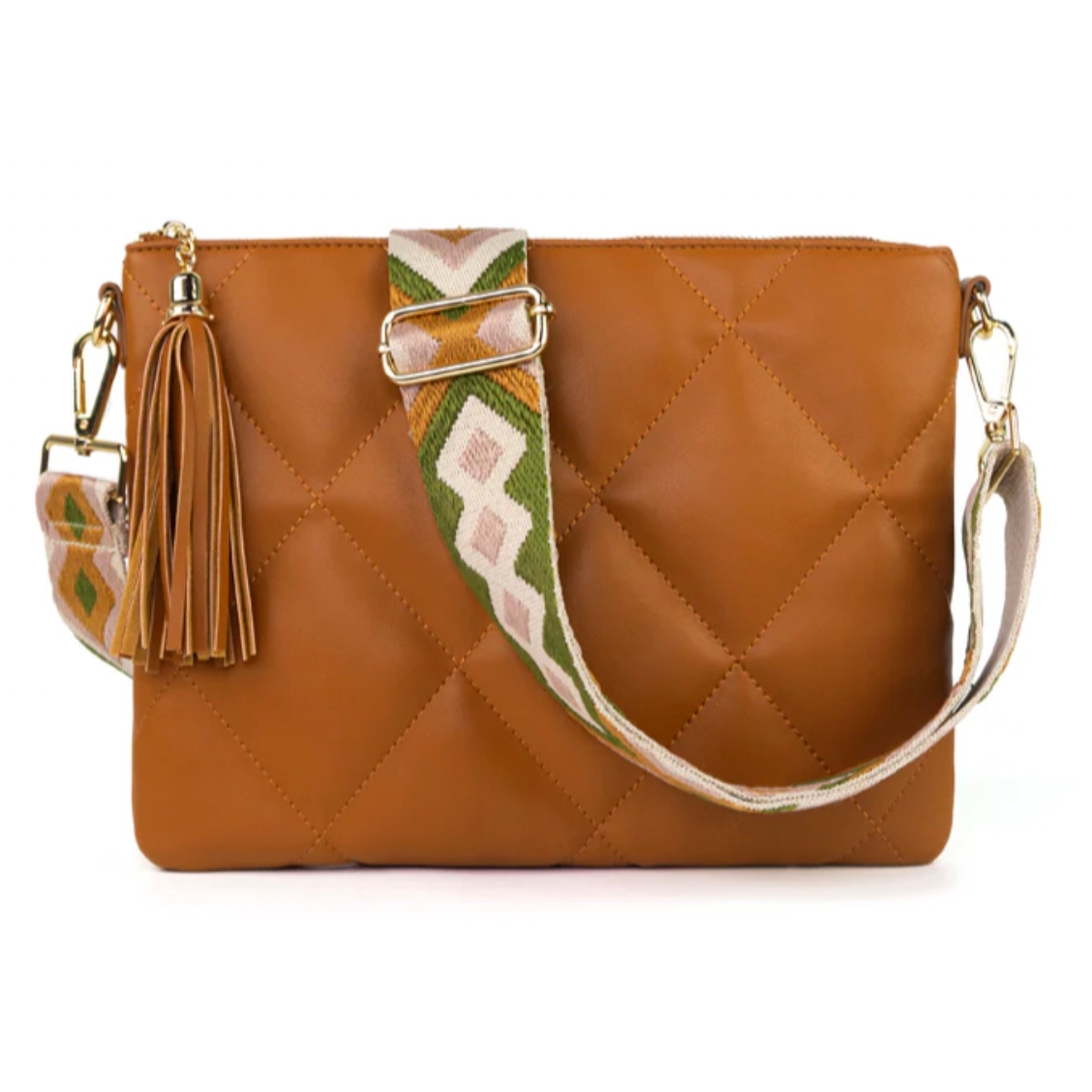 Tan quilted bag with a tassel detail and a colorful, patterned strap featuring geometric designs. Gold hardware adds a touch of elegance.