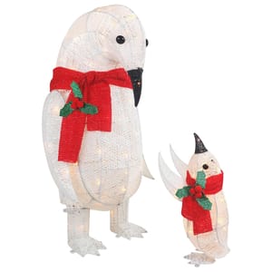 Two outdoor pre-lit penguin decorations, one large and one small, each wearing red scarves with holly accents. They feature a woven texture and are illuminated from within.