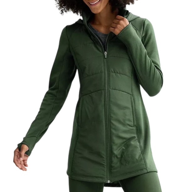 A person is wearing a long, green zip-up jacket with a fitted design, featuring a high collar and long sleeves. The outfit is complemented by matching green leggings.