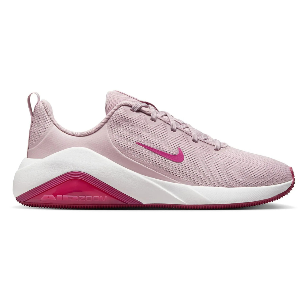A pink Nike Air Zoom sneaker with a white midsole and magenta details, featuring a lightweight mesh upper and lace-up closure.