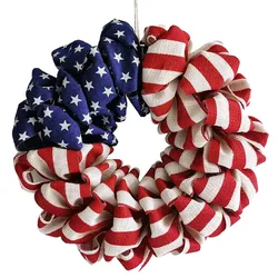 A round wreath made of burlap featuring the American flag design, with red and white stripes and a blue section with white stars.