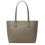 A taupe Kate Spade New York tote bag with dual handles and a saffiano leather finish.